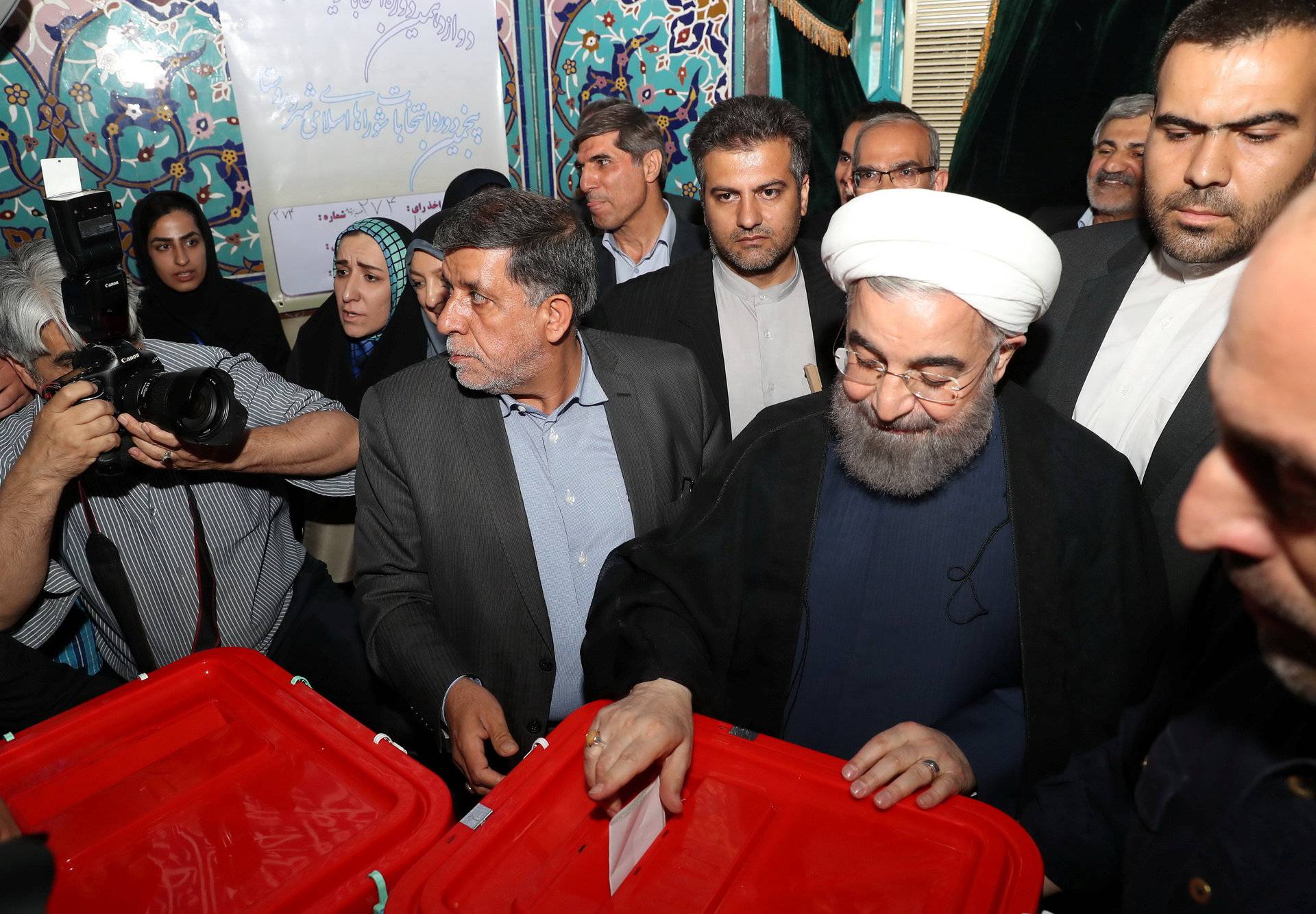 Iran's President Hassan Rouhani casts his ballot during the presidential election in Tehran