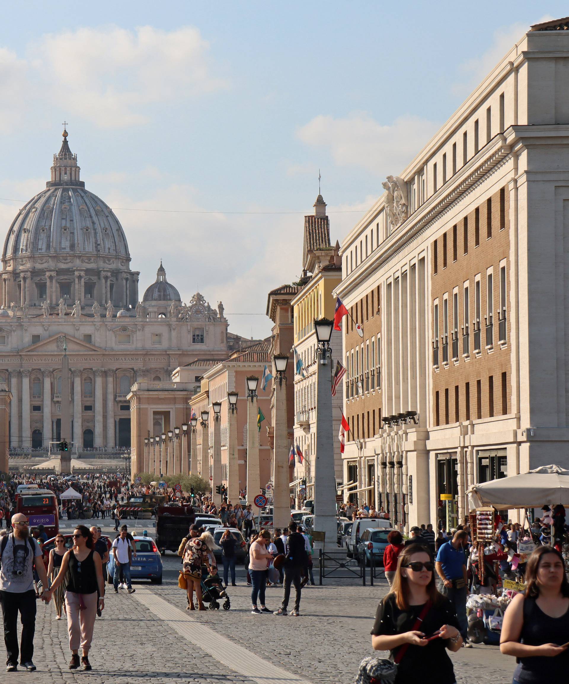 People walk the Via della Conciliazione leading to the Vatican City, in Rome