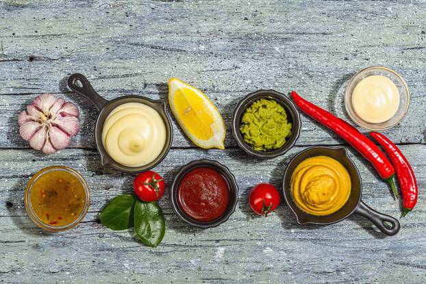 Set of sauces isolated on white background. Ketchup, mustard, mayonnaise, wasabi, sweet curry