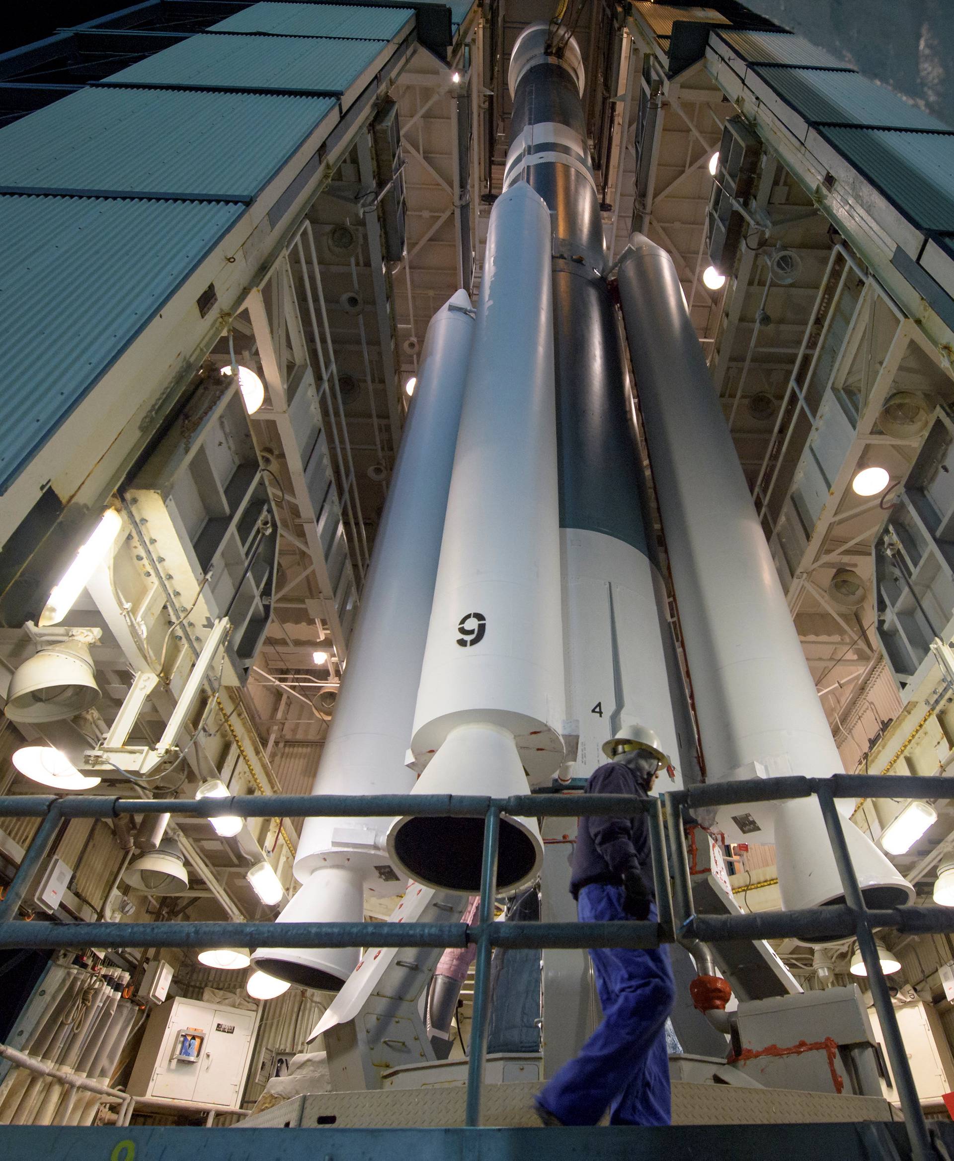 Workers prepare the United Launch Alliance Delta II rocket, with the NASA Ice, Cloud and land Elevation Satellite-2 (ICESat-2) onboard