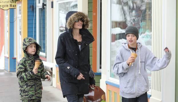 Angelina Jolie takes her kids shopping under the snow!