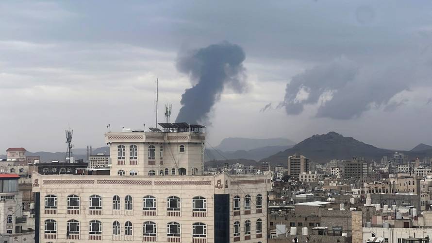 Smoke billows after an Israeli airstrike on Houthi infrastructure, in Sana'a