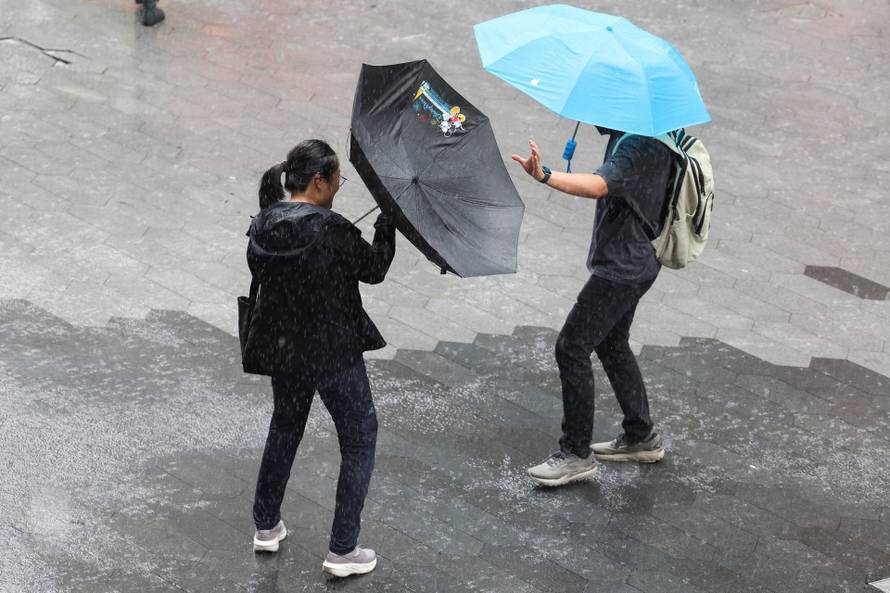 Heavy rain and high winds in Shanghai after Tropical Storm Co-May made landfall in a nearby city