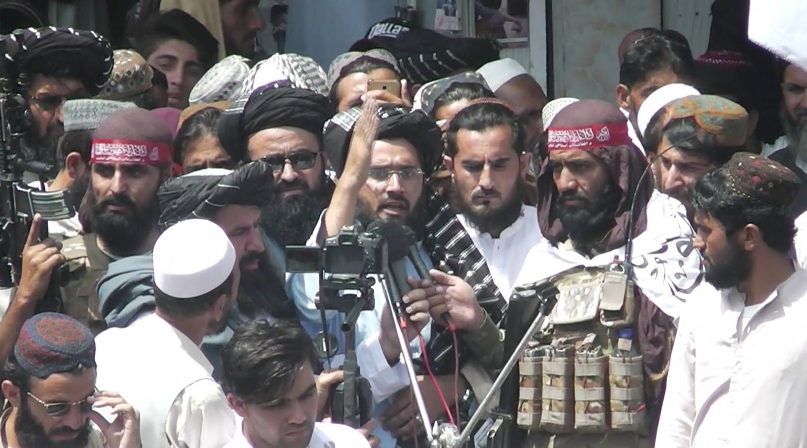 U.S. and NATO flags flank coffins at mock funeral held by Taliban