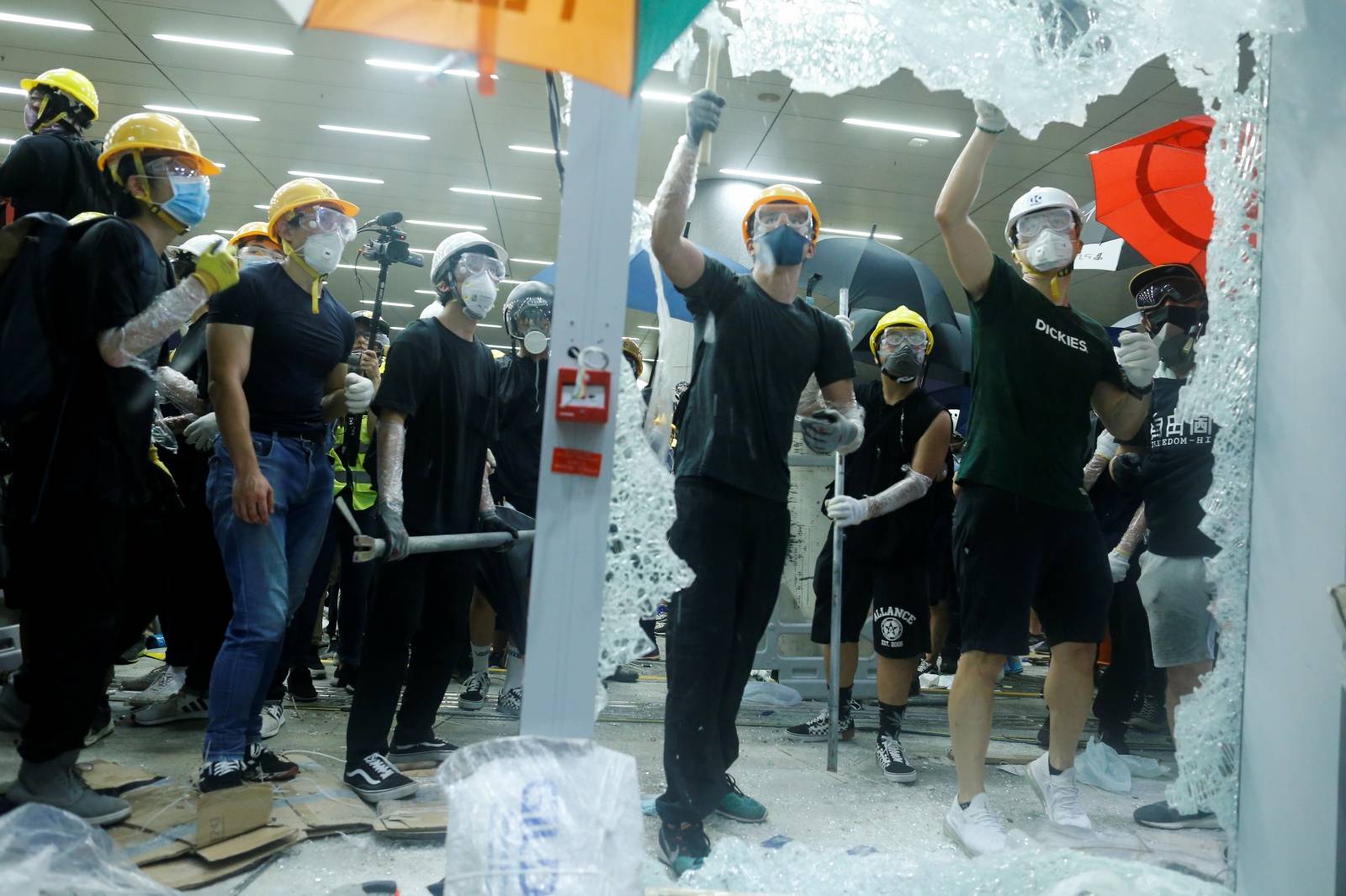 Protesters break the windows of the Legislative Council building on the anniversary of Hong Kong's handover to China in Hong Kong