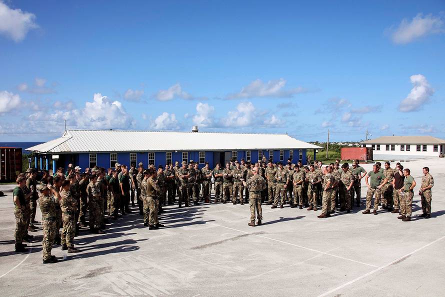 Members of Alpha Company, 40 Commando Royal Marines, are briefed in Barbados before traveling to the British Virgin Islands to help provide humanitarian assistance, in Barbados
