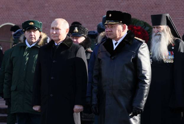 Russian President Vladimir Putin takes part in a ceremony on the Defender of the Fatherland Day in Moscow