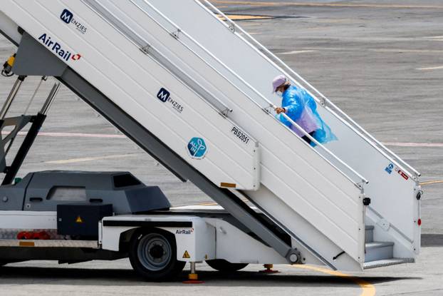 Passengers of the cruise ship MV Hondius, which was affected by a hantavirus outbreak, arrive at Tenerife Sud airport