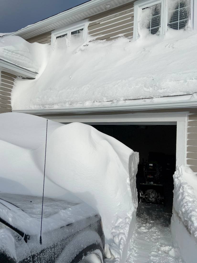 Pile of snow is pictured outside a house in St John's