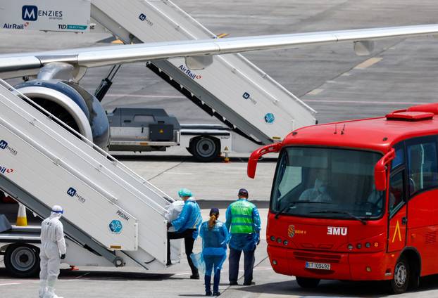 Passengers of the cruise ship MV Hondius, which was affected by a hantavirus outbreak, arrive at Tenerife Sud airport