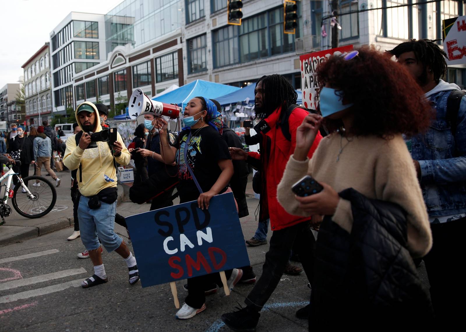 People protest at the CHAZ/CHOP zone around Seattle Police Department's East Precinct against racial inequality in the aftermath of the death in Minneapolis police custody of George Floyd, in Seattle