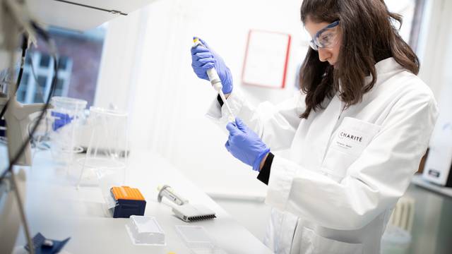 Charite hospital employees prepare a test for new coronavirus in Berlin