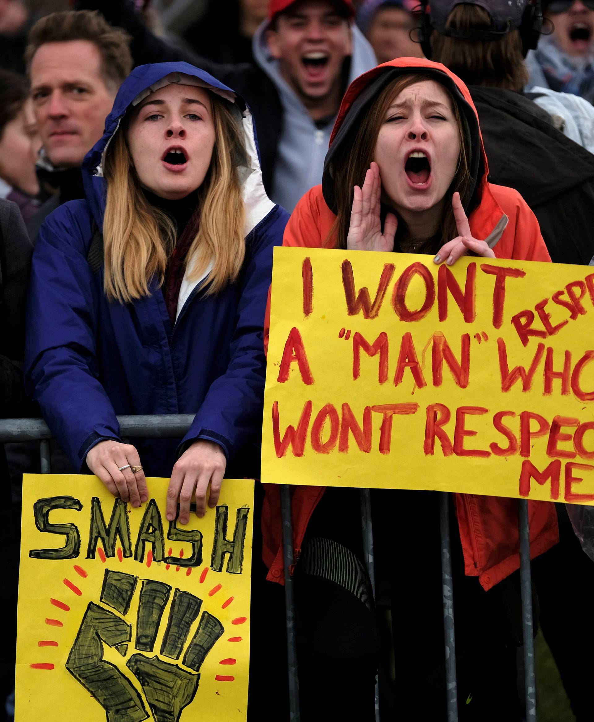 Demonstrators against U.S. President Donald Trump scream in protest on the National Mall as he finishes his inaugural address in Washington