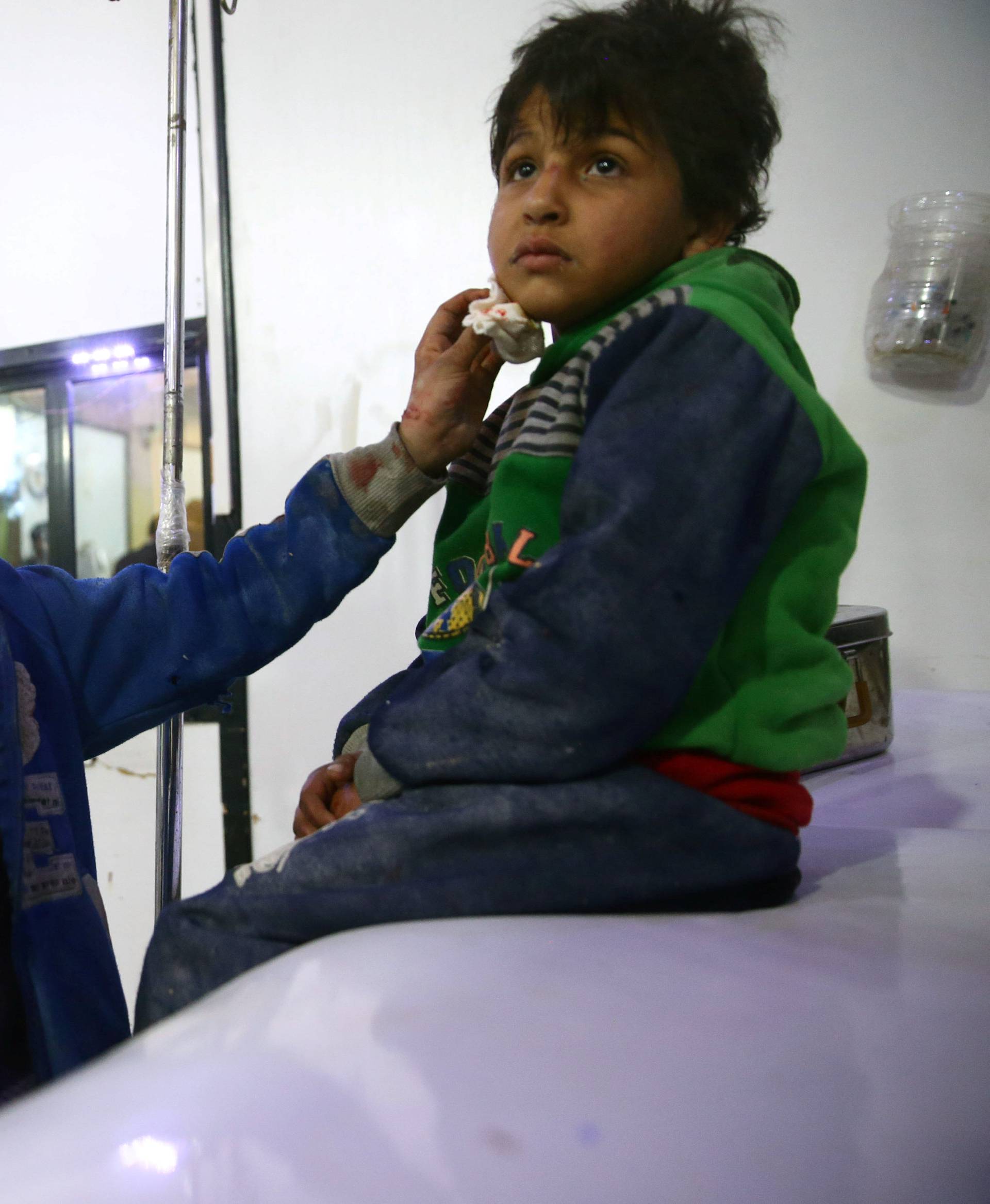 Wounded children are seen in a hospital in the besieged town of Douma, Eastern Ghouta, Damascus