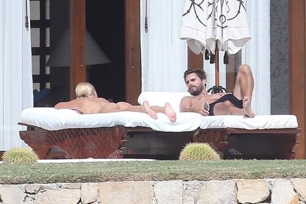 *EXCLUSIVE* Sofia Richie lounges topless with Scott Disick while on vacation