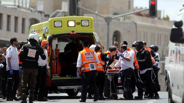 Israeli medics evacuate an injured person following a stabbing attack just outside Jerusalem's Old City, according to Israeli police