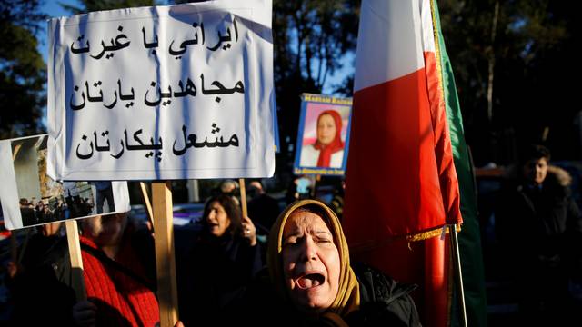 Opponents of Iranian President Hassan Rouhani hold a protest outside the Iranian embassy in Rome