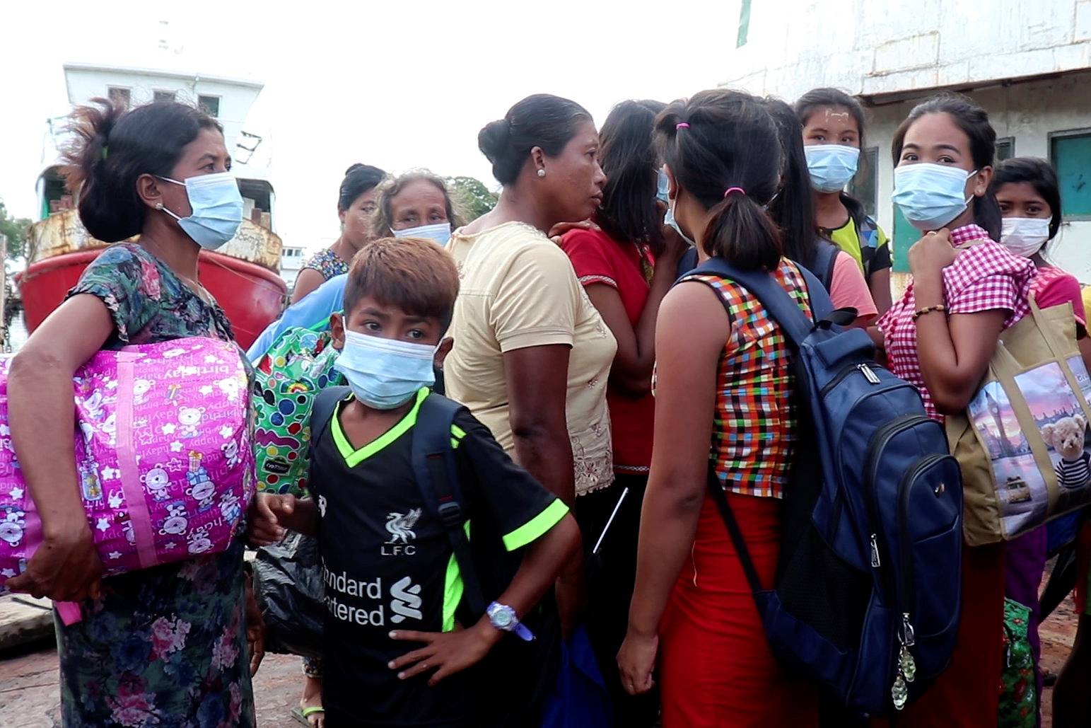 People who fled from Rathedaung Township arrive in Sittwe, the capital of Rakhine State