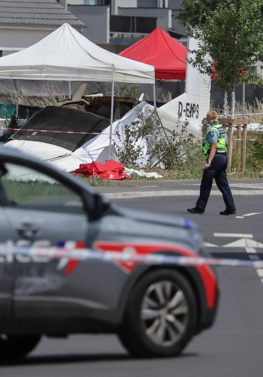 French rescuers work at the site of a plane crash, in Tomblaine