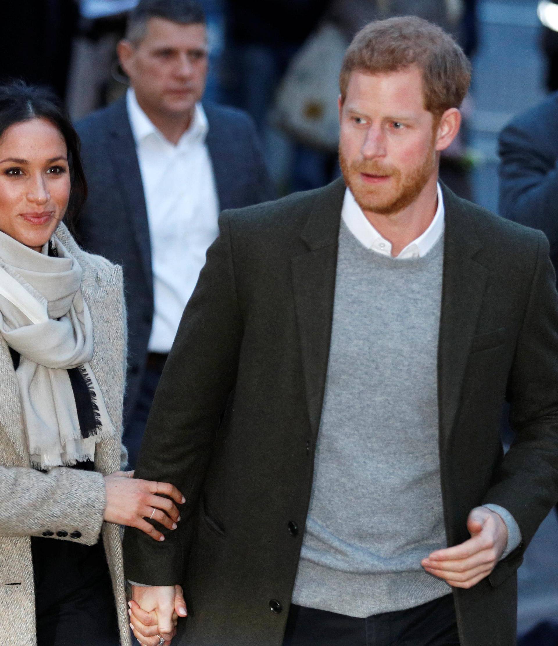 Britain's Prince Harry and his fiancee Meghan Markle leave after visiting radio station Reprezent FM, in Brixton, London