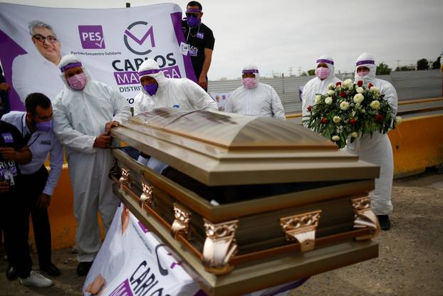 Carlos Mayorga, Mexican candidate for federal representative, lies in a coffin as part of his campaign slogan "If I don