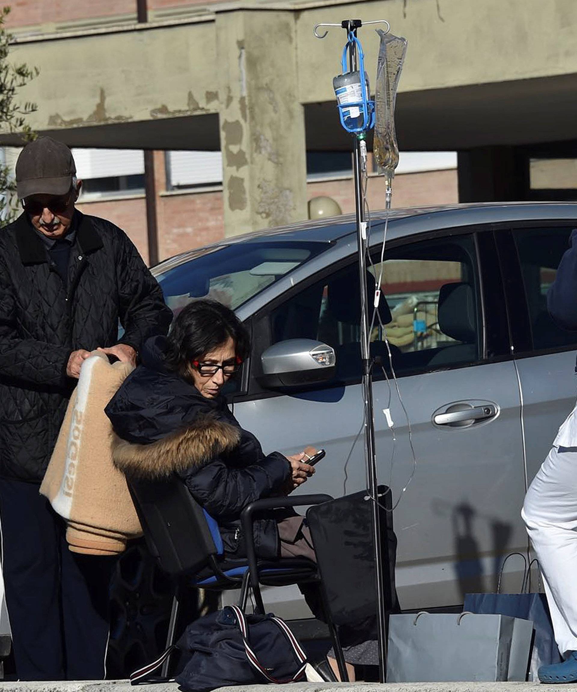 A patient is evacuated from an hospital following an earthquake in Rieti