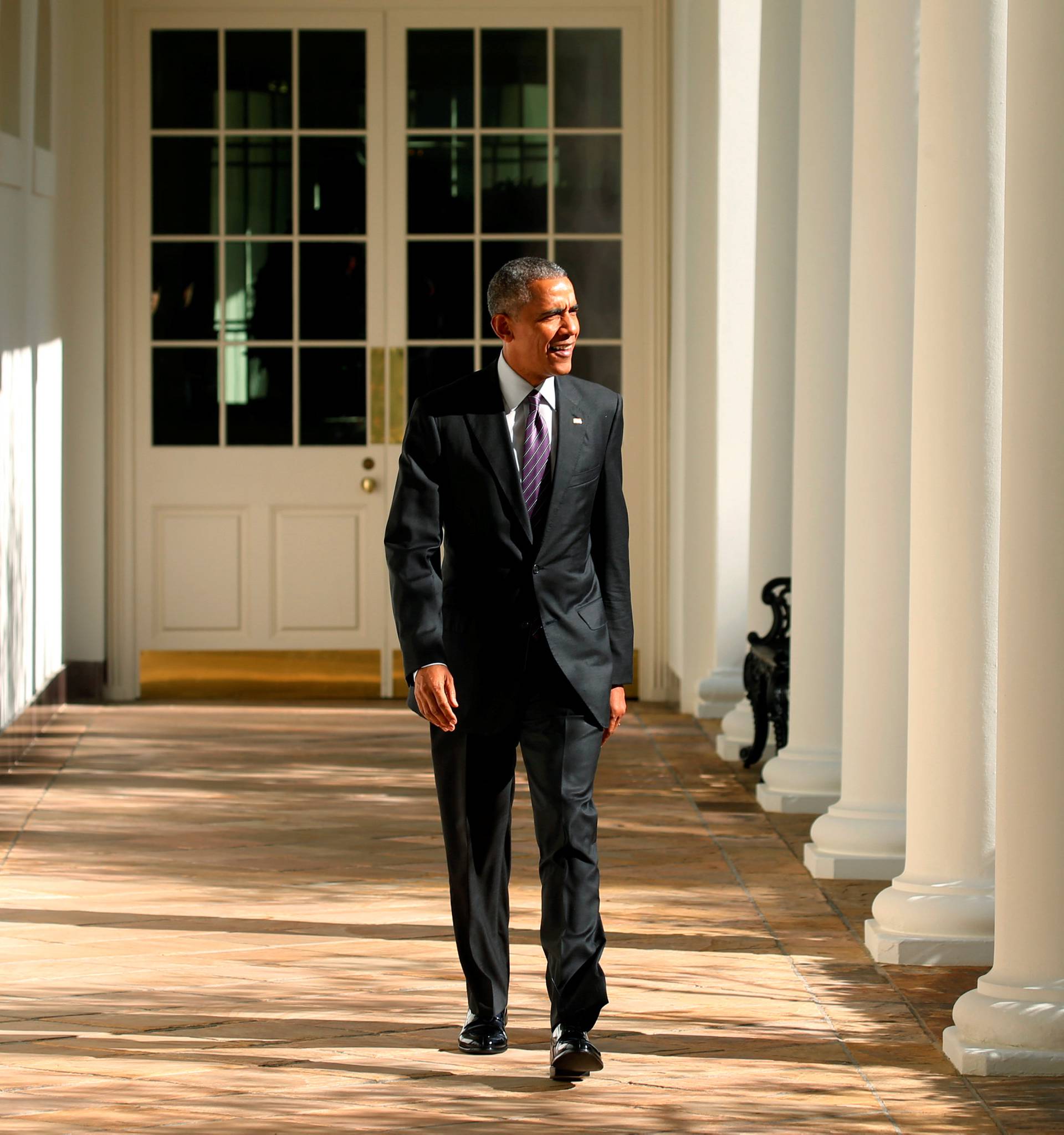 U.S. President Barack Obama walks the Colonnade toward the Oval Office of the White House in Washington on election day