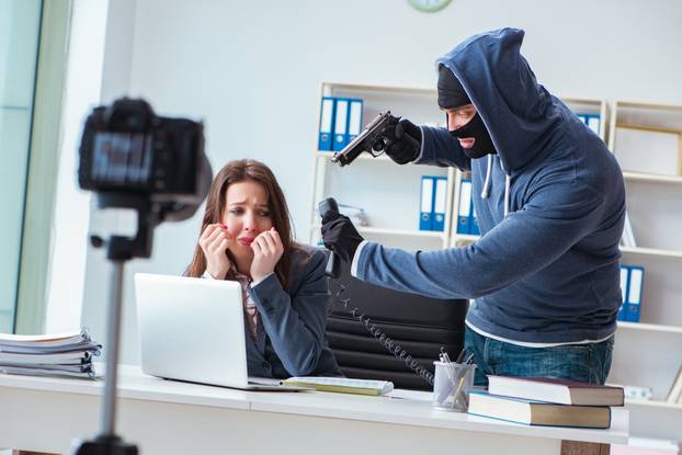 Criminal recording message for ransom with victim businesswoman