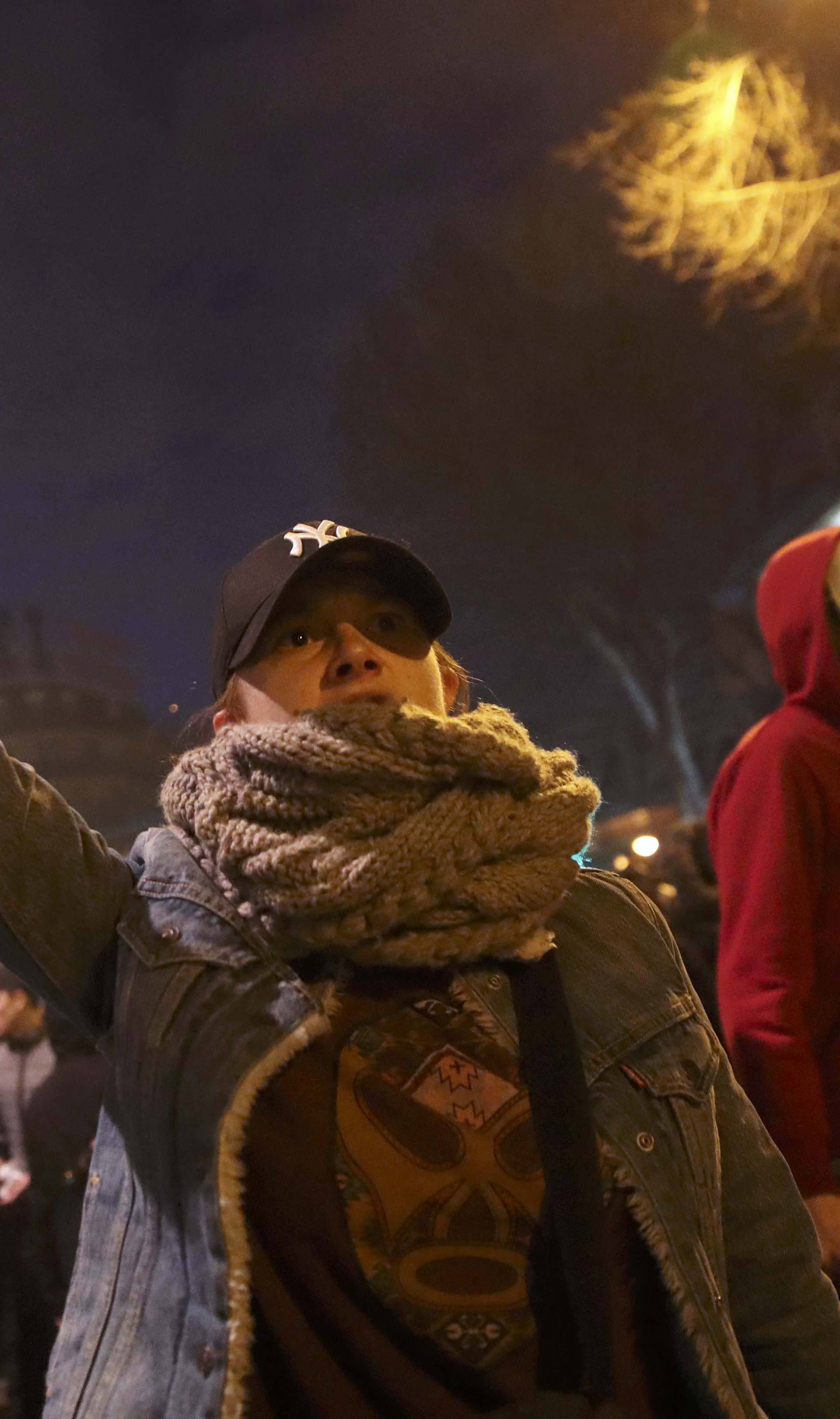  A man reacts at a protest against police brutality after a young black man, 22-year-old youth worker named Theo, was severly injured during his arrest, as people gather at a demonstration in Paris 