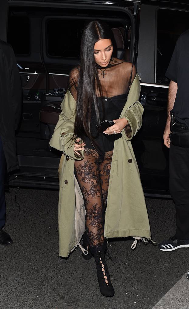 Kim Kardashian is seen at arriving at Kinu Restaurant in Paris with Kris Jenner, Kendall Jenner, Kourtney Kardashian and Corey Gamble