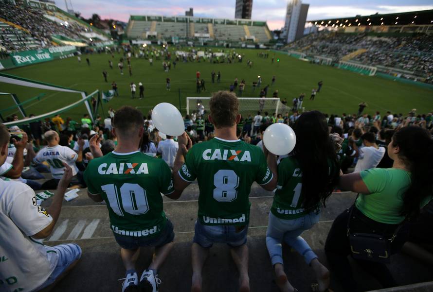 Fans of Chapecoense soccer team pay tribute to Chapecoense's players at the Arena Conda stadium in Chapeco