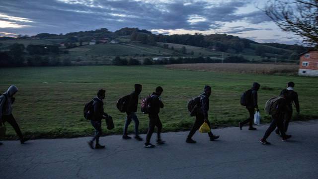 FILE PHOTO: Migrants gather before trying to cross the Bosnia-Croatia border near Velika Kladusa