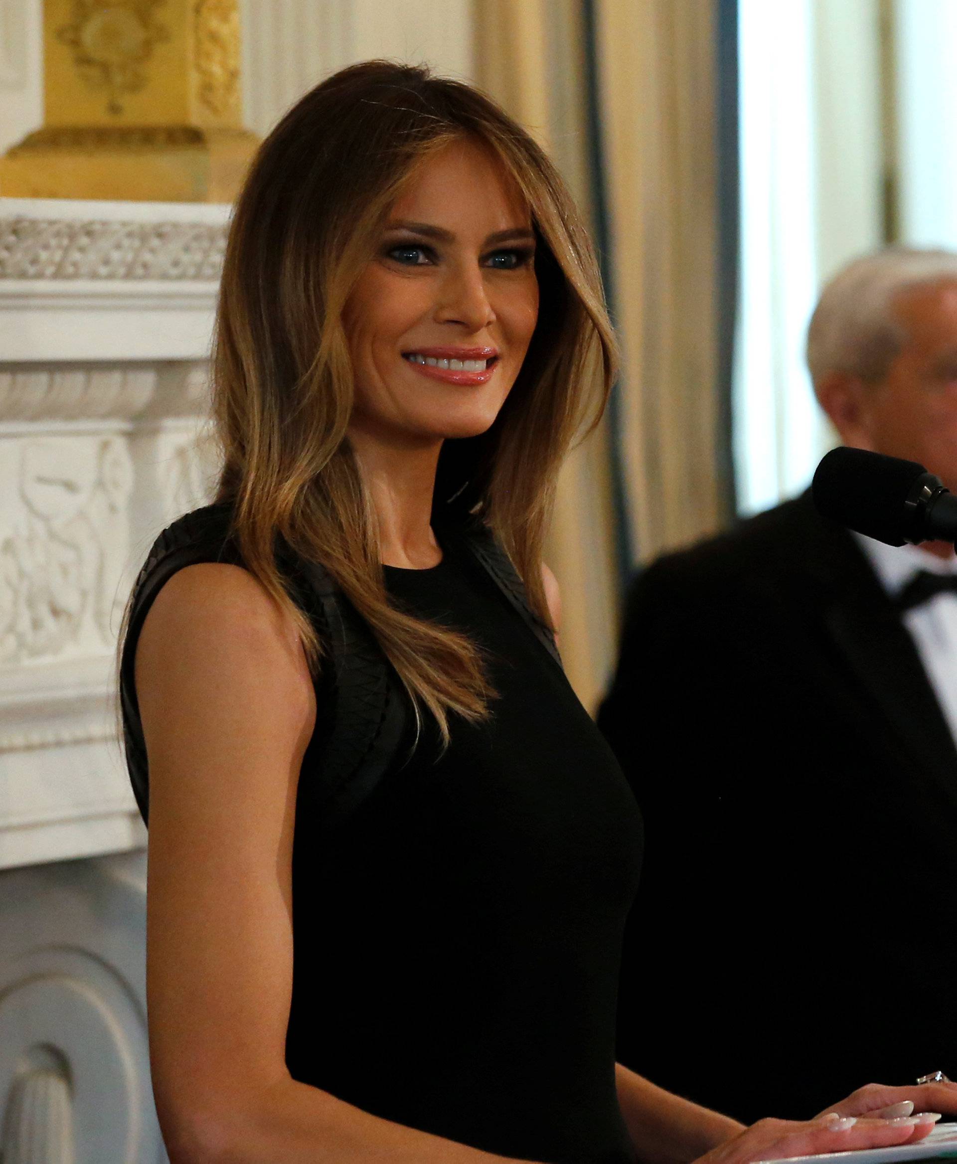 Melania Trump arrives to join her guests for an International Women's Day luncheon at the White House in Washington