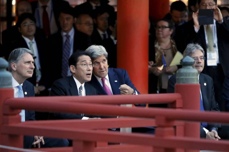 Kerry talks to Kishida during a ceremonial dance at the Itsukushima Shrine, as they and Hammond and Gentiloni take a cultural break from their G7 foreign minister meetings in nearby Hiroshima to visit Miyajima Island