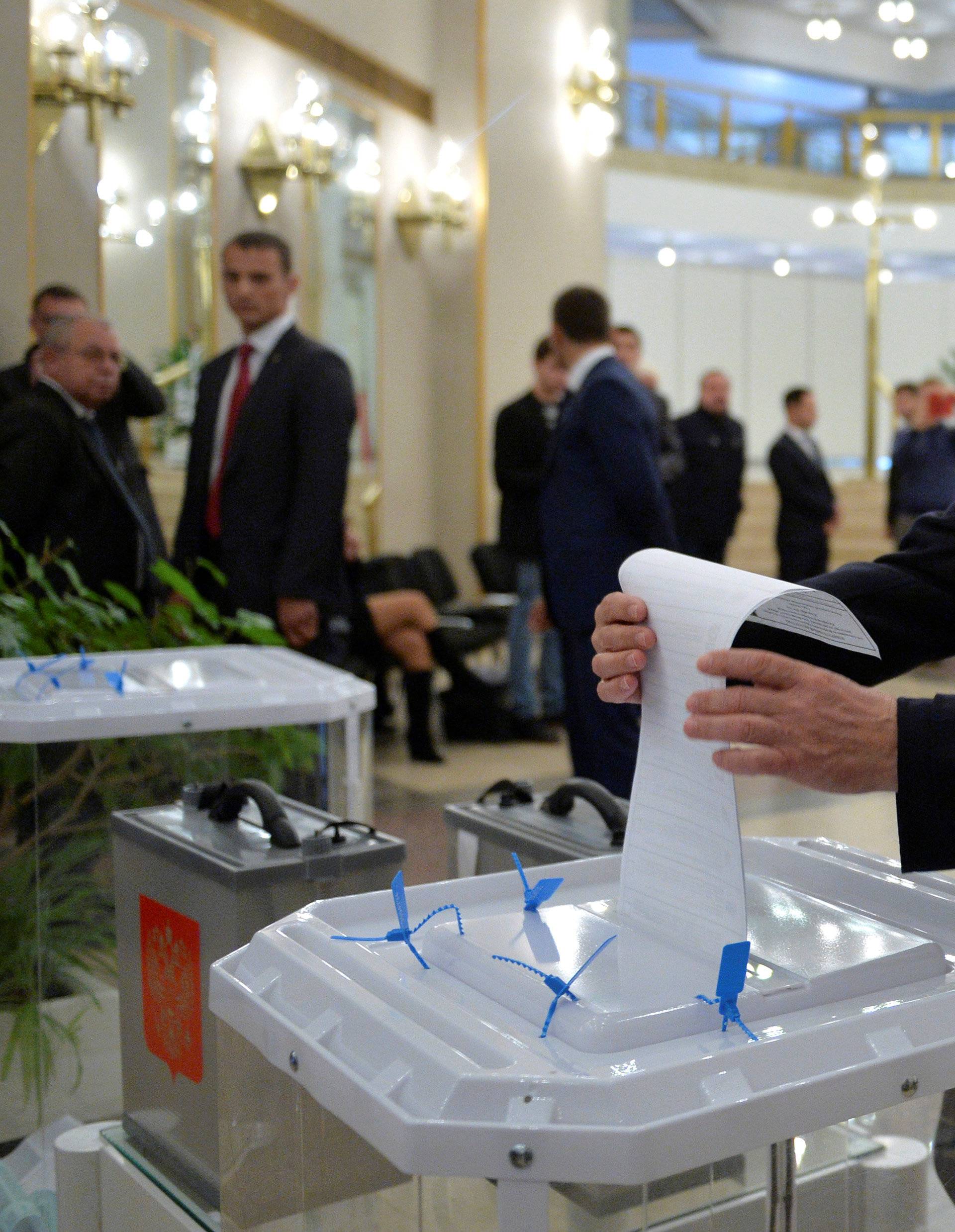 Russian President Putin casts ballot at polling station during parliamentary election in Moscow