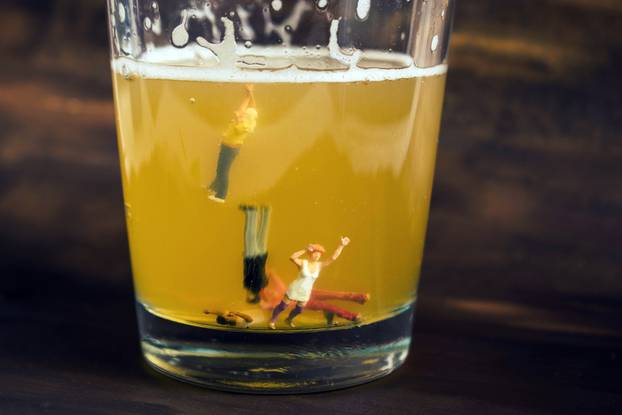 Anonymous,,Unrecognizable,Miniature,People,In,A,Glass,Of,Beer.,Binge
