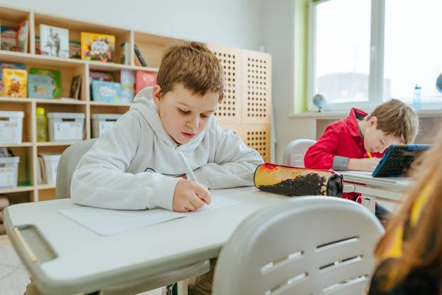 Elementary school students learning in the classroom