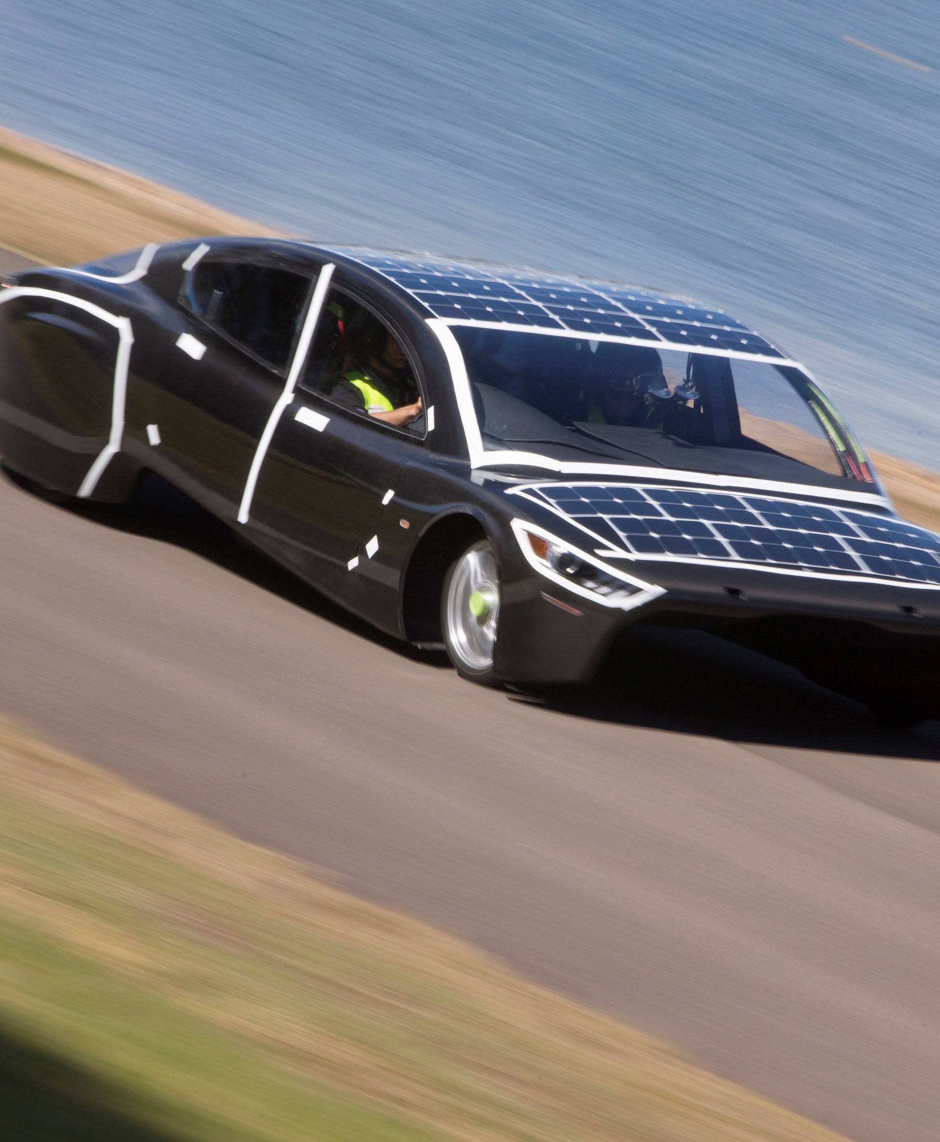 The University of New South Wales Sunswift team car named 'Violet' is driven during testing in Penrith western Sydney, Australia