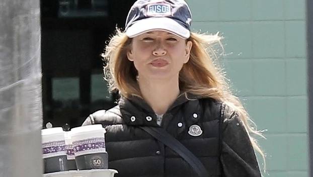 EXCLUSIVE: Renee Zellweger displays her significantly larger lips as she goes on a coffee run at Peet's Coffee & Tea