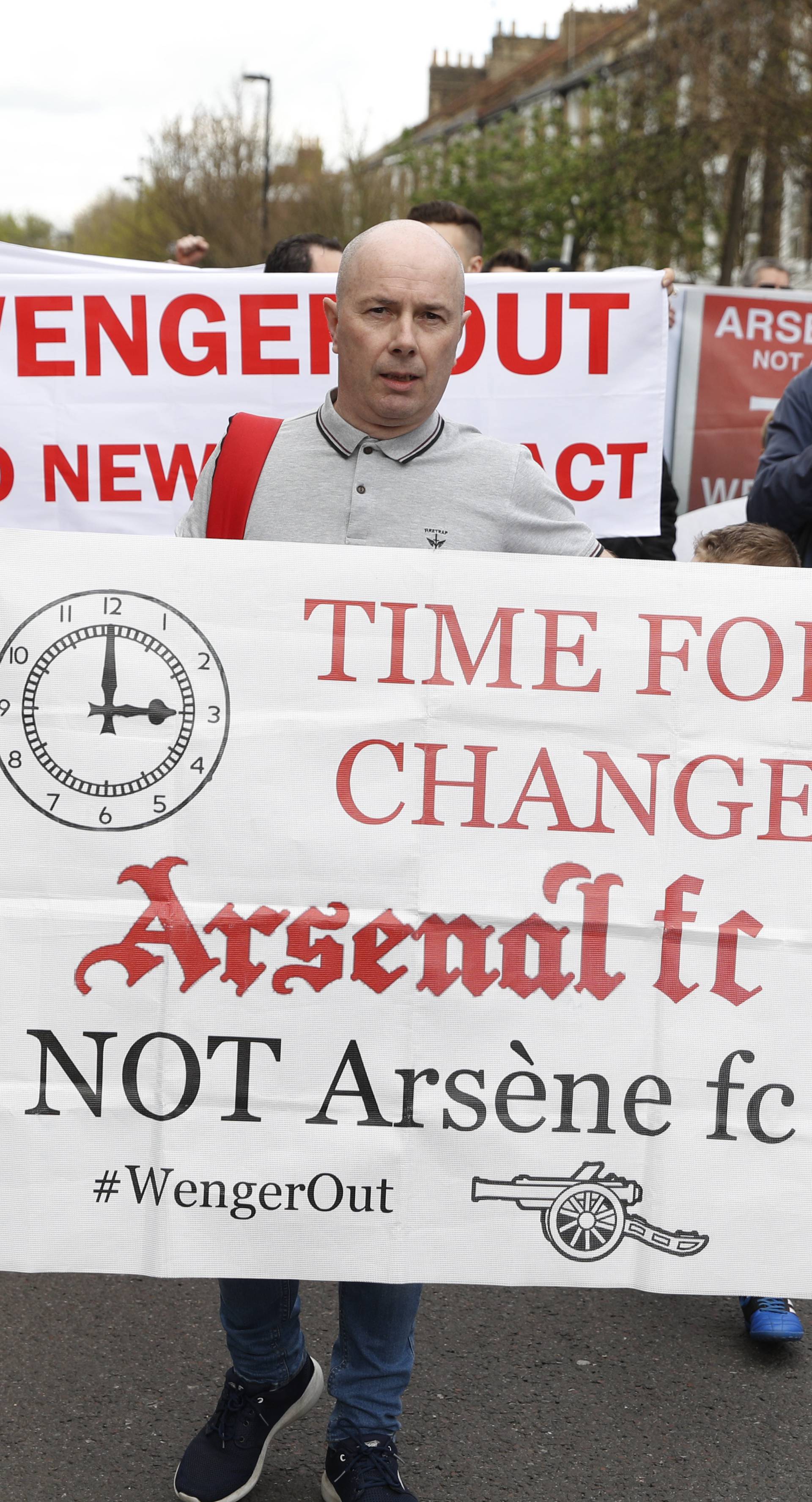 Arsenal fans protest against manager Arsene Wenger outside the stadium before the game