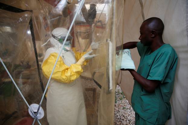 A health worker wearing Ebola protection gear enters the Biosecure Emergency Care Unit at the ALIMA Ebola treatment centre in Beni