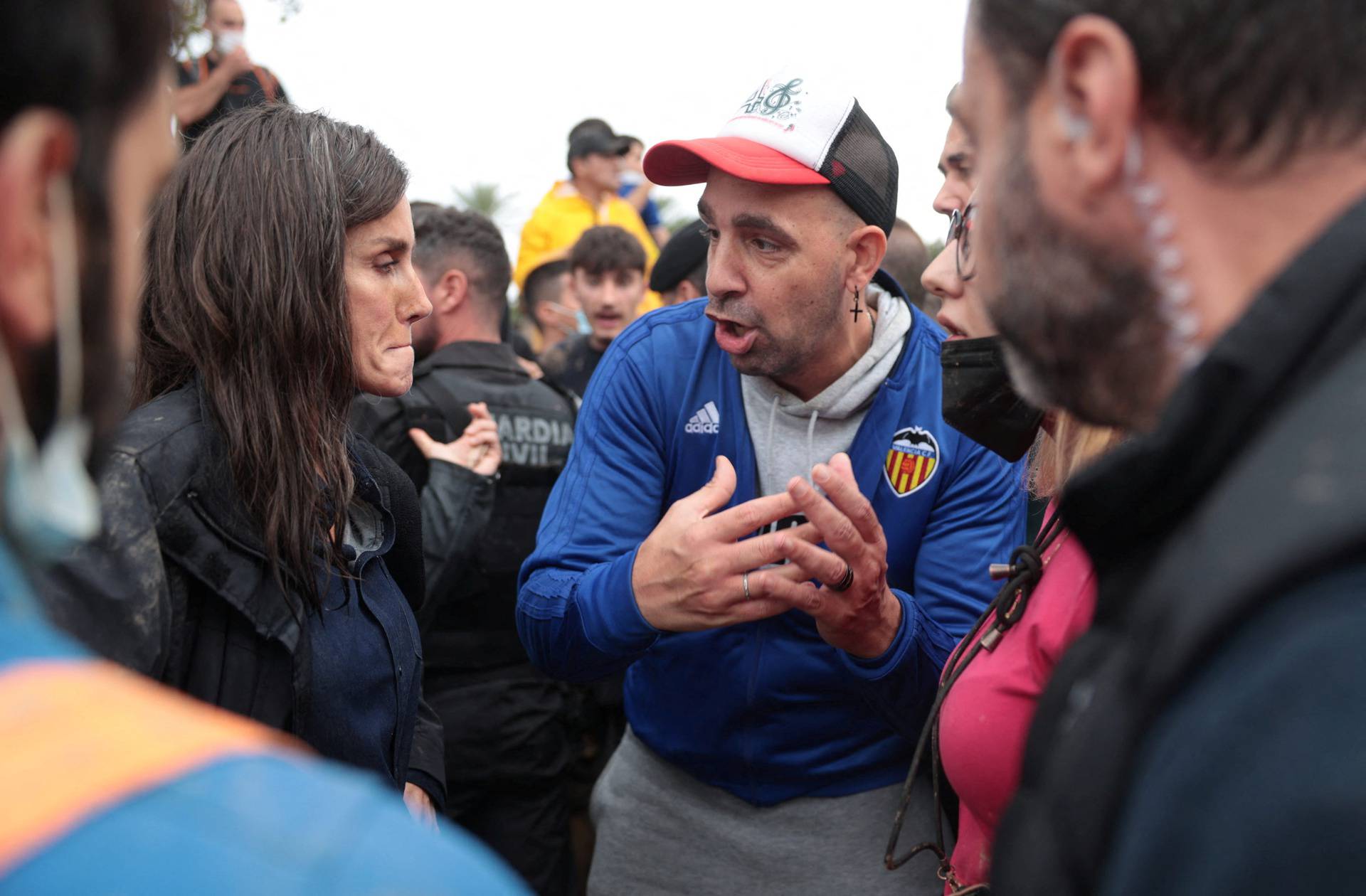 Spain's Queen Letizia reacts with mud thrown at her during visit to flood-affected area in Paiporta