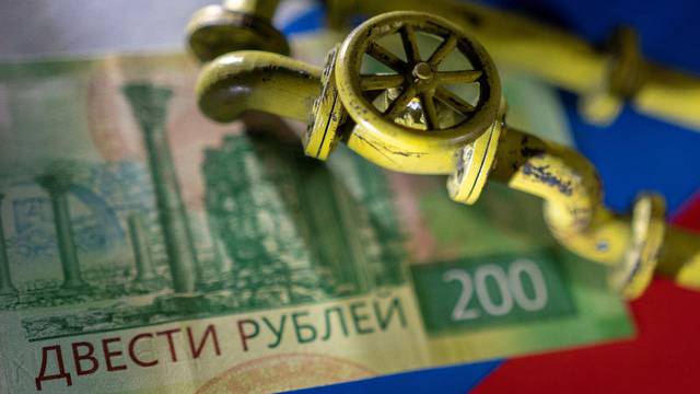 Illustration shows natural gas pipeline, Russian Rouble banknote and flag