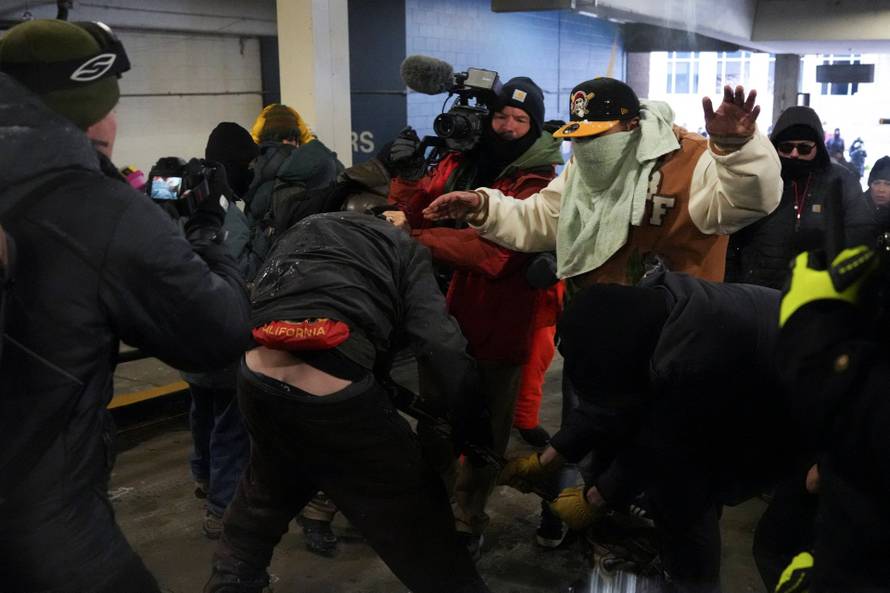 People attend the "March Against Minnesota Fraud" in Minneapolis