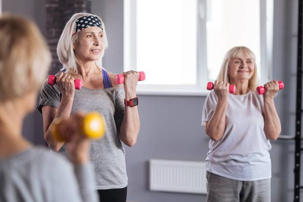 Delighted active women enjoying their fitness workout