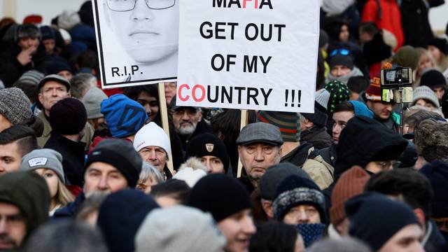 Participants march in honor of murdered Slovak investigative reporter Jan Kuciak in Bratislava