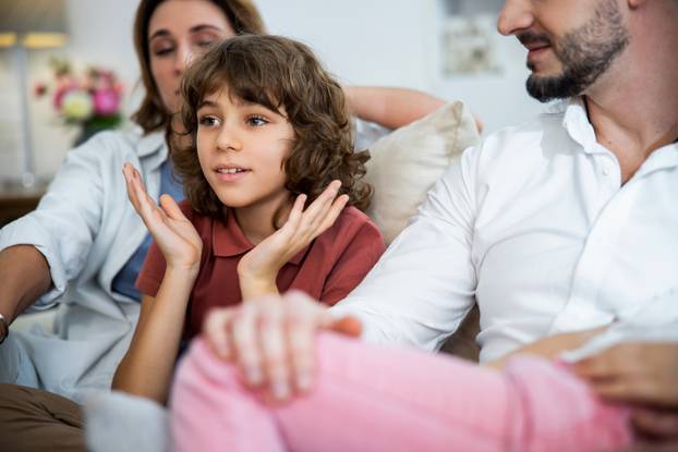 Surprised boy is fascinated watching for something