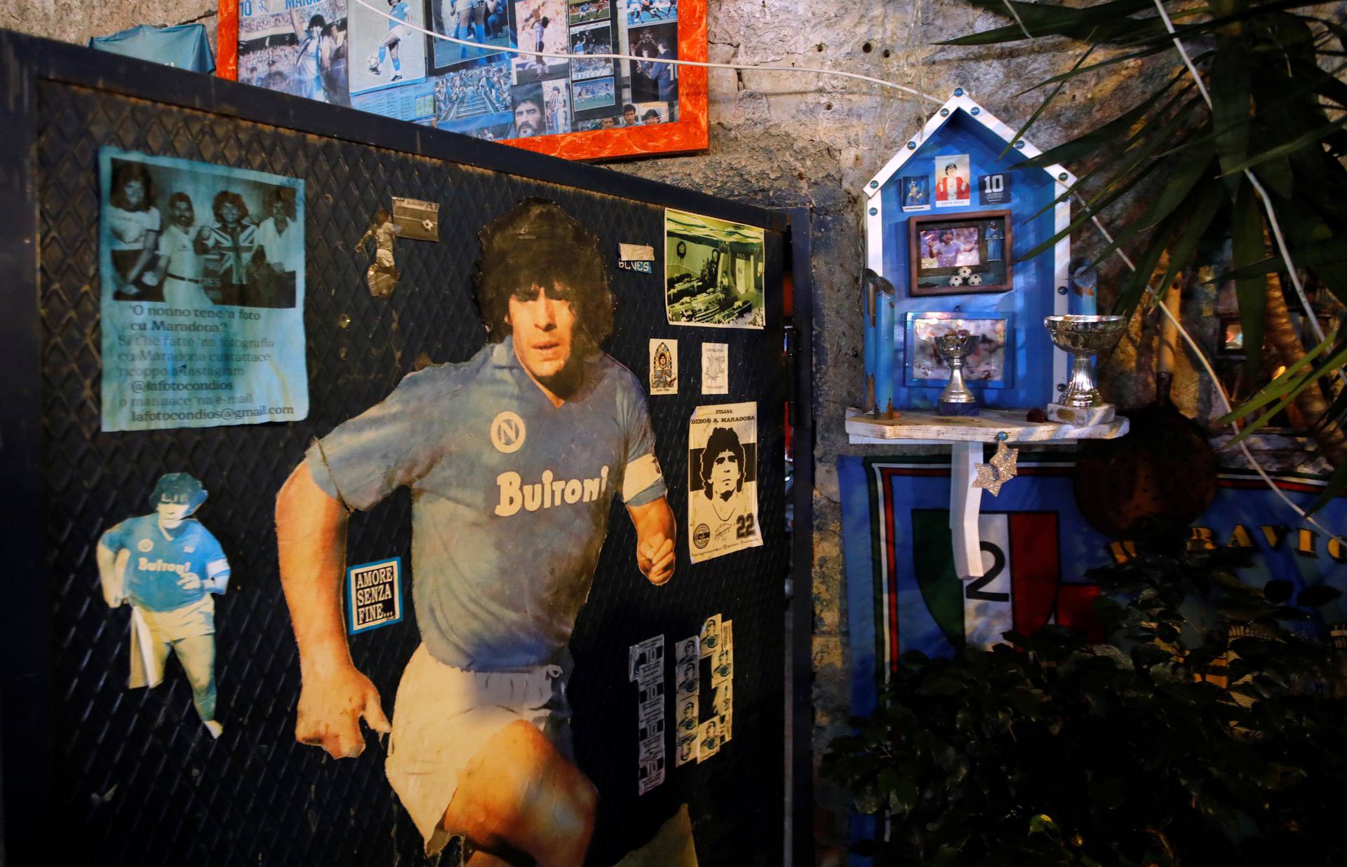 A picture of Argentine soccer legend Diego Maradona is seen in the Spanish Quarter of Naples after the announcement of his death, in Naples
