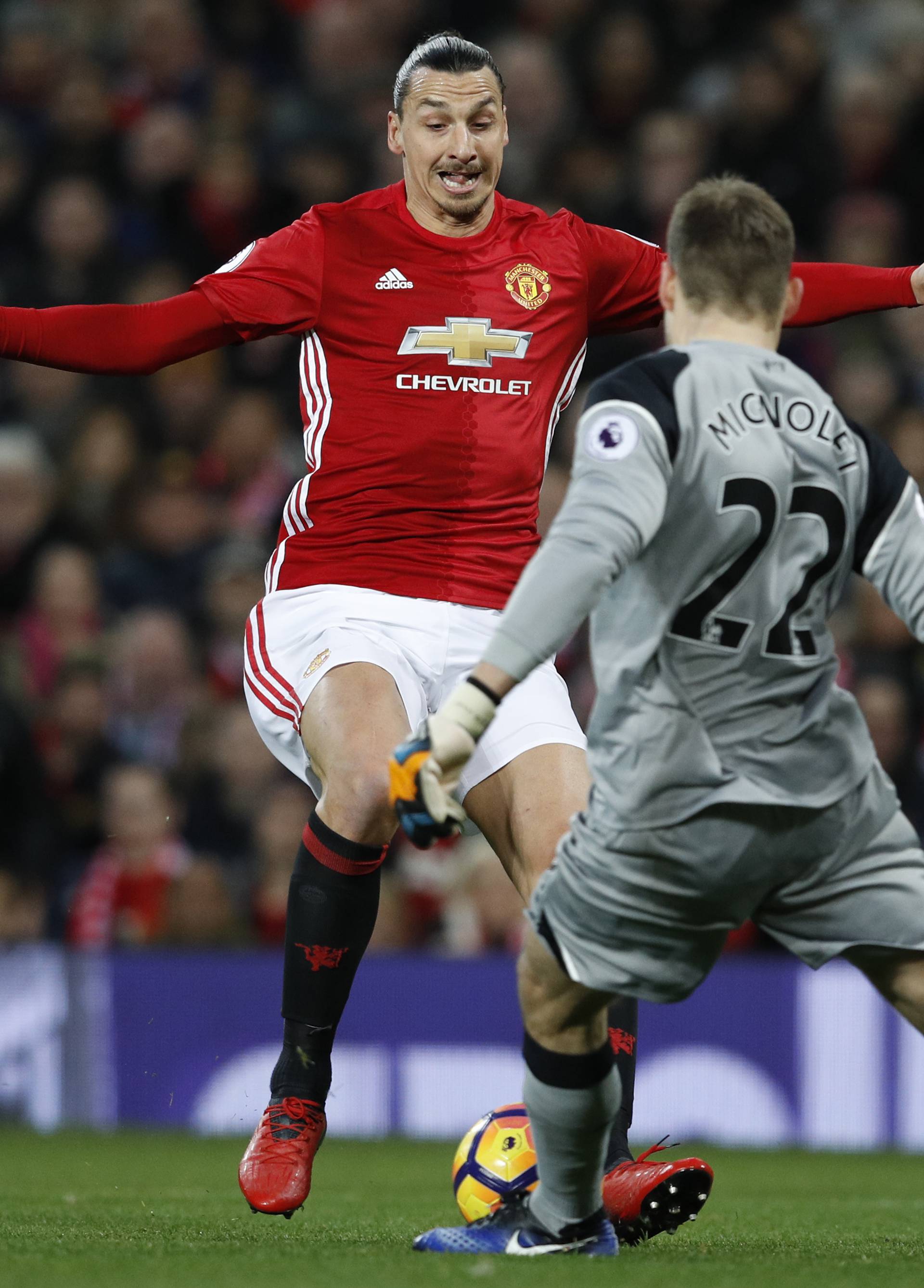 Manchester United's Zlatan Ibrahimovic blocks the clearance of Liverpool's Simon Mignolet