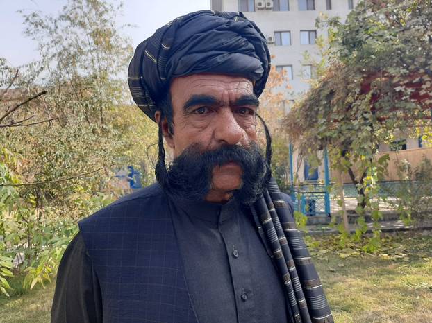 Moustache makes Afghan tailor a celebrity